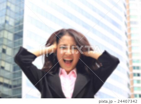 Asian woman in business suite with  angry face 24407342