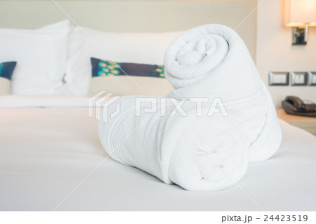 White towel on bed 24423519