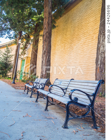 Wood Bench against concrete wall . Wood Bench against concrete wall . 24426696