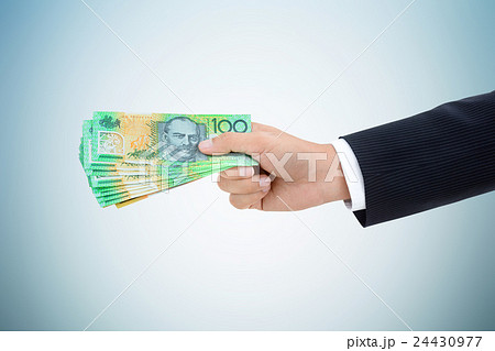 Businessman hand giving money, Australian dollars 24430977