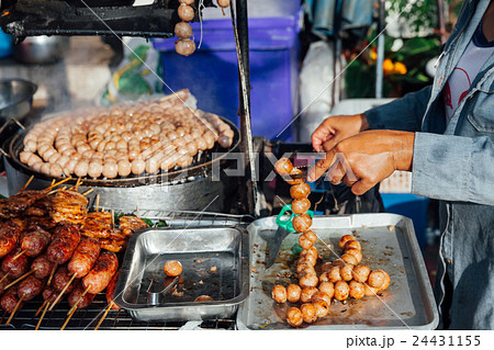Thai woman cooks meatballs 24431155