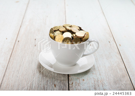 cup of coffee with gold coins of malaysian ringgit 24445363