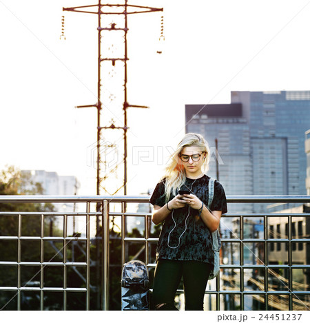 Young Woman Skater Browsing Phone Concept 24451237