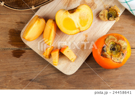 Persimmon yellow color fruits 24458641