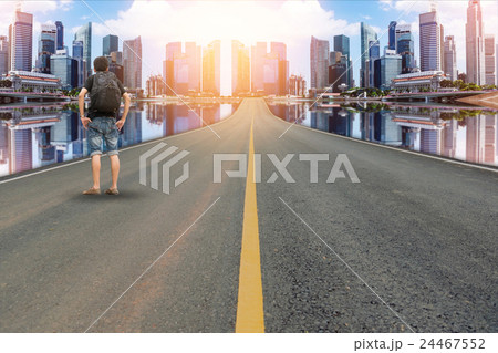 Backpacker on the road in the city Backpacker on the road in the city 24467552