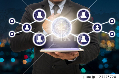 Businessman holding the tablet with the Social media symbol on Blurred Photo bokeh of cityscape, Elements of this image furnished by NASA, Business network concept Businessman holding the tablet with the Social media symbol on Blurred Photo bokeh of cityscape, Elements of this image furnished by NASA, Business network concept 24475728
