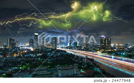 Bangkok cityscape Modern building river side at twilight time with thunder lightnings and storm on the sky with cloud background and boat traffic light,Thailand 24477948