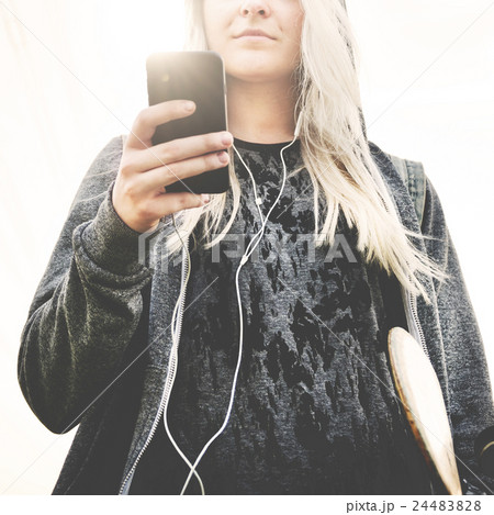 Young Woman Skater Browsing Phone Concept 24483828