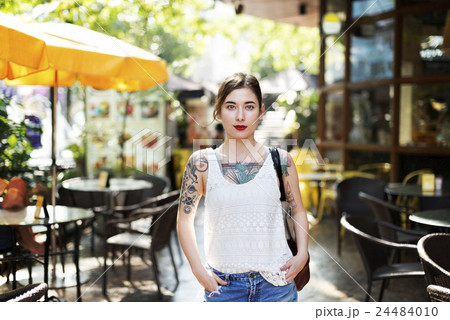 Pretty Tattooed Girl Cafe Relaxation Concept 24484010