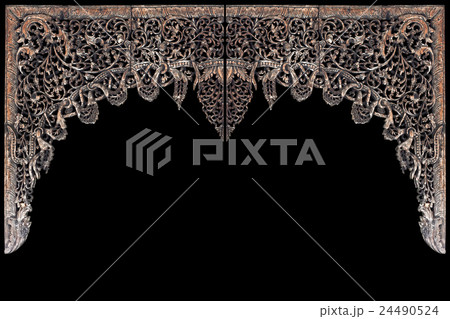 Traditional Thai style wood carving for interior decoration isolated on black. Saved with clipping path 24490524