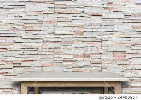 Empty top of natural stone table and stone wall background Empty top of natural stone table and stone wall background 24490857