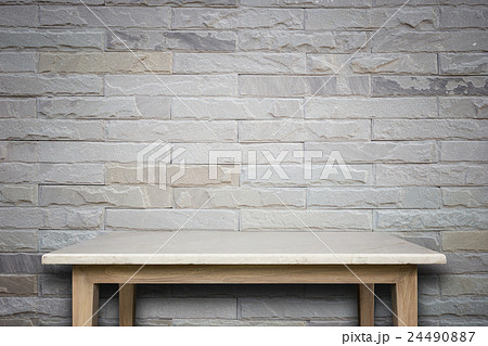 Empty top of natural stone table and stone wall background Empty top of natural stone table and stone wall background 24490887