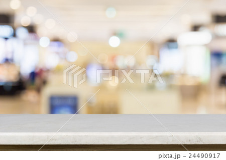 Empty top of natural stone table and blur with bokeh background Empty top of natural stone table and blur with bokeh background 24490917