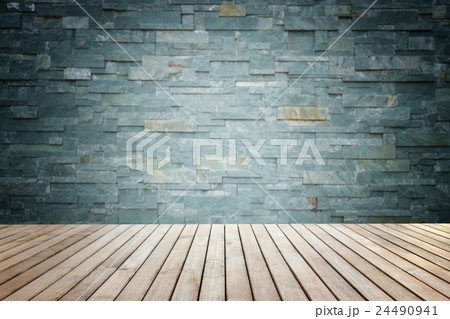 Empty top of wooden floor and natural stone wall 24490941