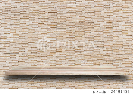 Empty top wooden shelves and stone wall background 24491452
