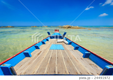 Front of traditional Thai boat and view of tropical sea Front of traditional Thai boat and view of tropical sea 24491972