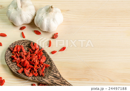 Dried goji berries on wooden tablespoon 24497188