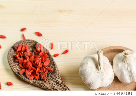 Dried goji berries on wooden tablespoon Dried goji berries on wooden tablespoon 24497191
