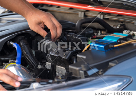 Hand man checking car engine Hand man checking car engine 24514739