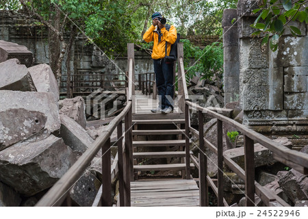 Tourist take a photo in ancient temple . 24522946