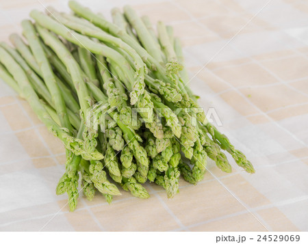 Fresh asparagus, on The fabric is placed. Fresh asparagus, on The fabric is placed. 24529069