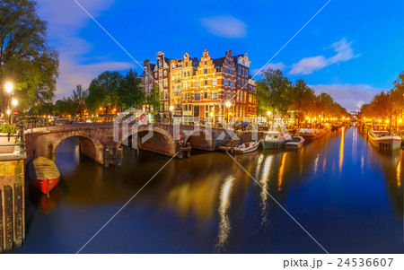 Night city view of Amsterdam canal and bridge 24536607