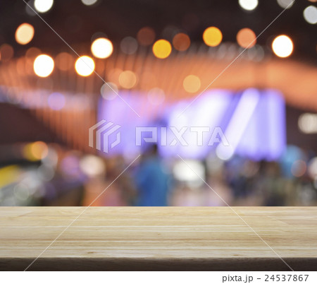 Wooden table over blur light and shadow o fmall Wooden table over blur light and shadow o fmall 24537867