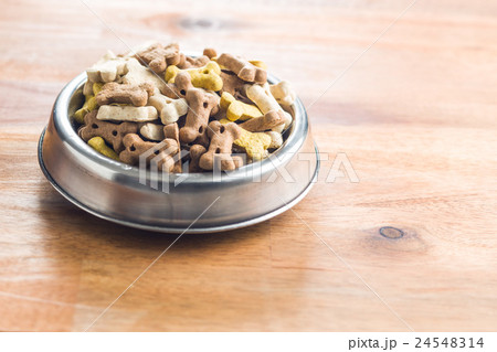 Dog food shaped like bones. 24548314