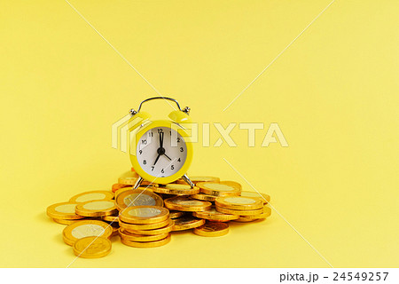 alarm clock and coins 24549257