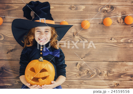 little witch with a pumpkin 24559556
