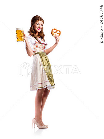 Woman in traditional bavarian dress holding beer Woman in traditional bavarian dress holding beer 24565746