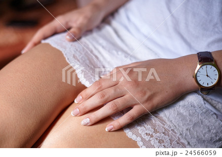 bride's hands with a clock and manicure 24566059