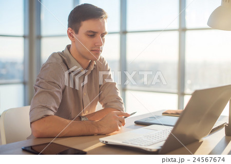 Man freelancer businessman working on laptop Man freelancer businessman working on laptop 24567674