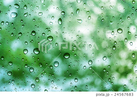 Water Drops on Glass with Blurred Green Bokeh Water Drops on Glass with Blurred Green Bokeh 24567683