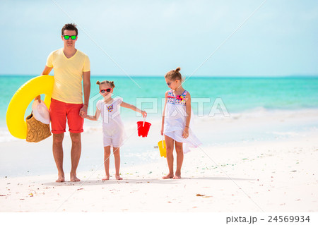 Happy family on beach vacation Happy family on beach vacation 24569934