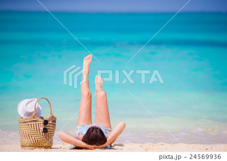 Young beautiful woman during tropical beach Young beautiful woman during tropical beach 24569936