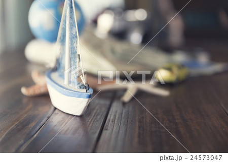 map, globe, ship and car figurine, starfish 24573047