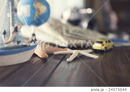 map, globe, ship and car figurine, starfish 24573049