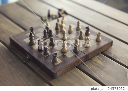 pawn and chessboard game on wooden table pawn and chessboard game on wooden table 24573052