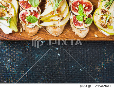 Crostini with pear, ricotta cheese, figs, nuts and Crostini with pear, ricotta cheese, figs, nuts and 24582681