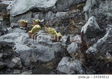 Basket of sulfur nuggets at Kawah Ijen volcano  24584612
