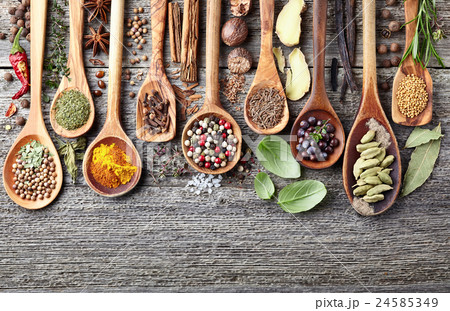 Herbs with spices on a wooden background Herbs with spices on a wooden background 24585349