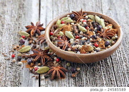 Spices mix on a wooden background 24585589