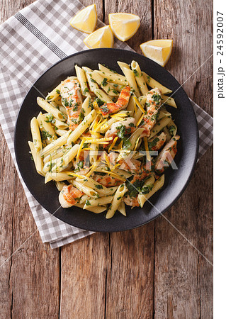 Penne Pasta with pesto, chicken breast and lemon Penne Pasta with pesto, chicken breast and lemon 24592007