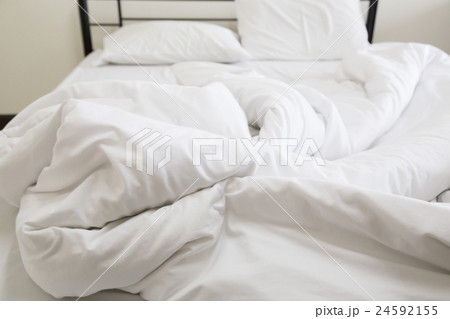 View of an unmade bed 24592155