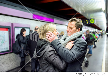 Senior couple standing at the underground platform Senior couple standing at the underground platform 24592853