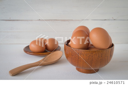 Fresh eggs on wooden background 24610571