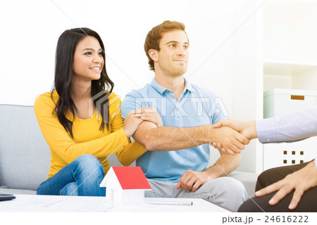 Young couple meeting with real estate agent  24616222