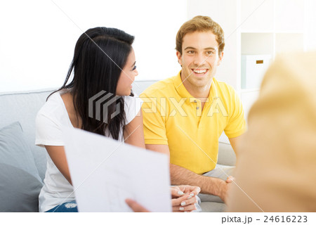 Young mixed race couple meeting with consultant Young mixed race couple meeting with consultant 24616223
