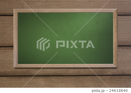 Blank old school blackboard on a grunge wall. 24618640